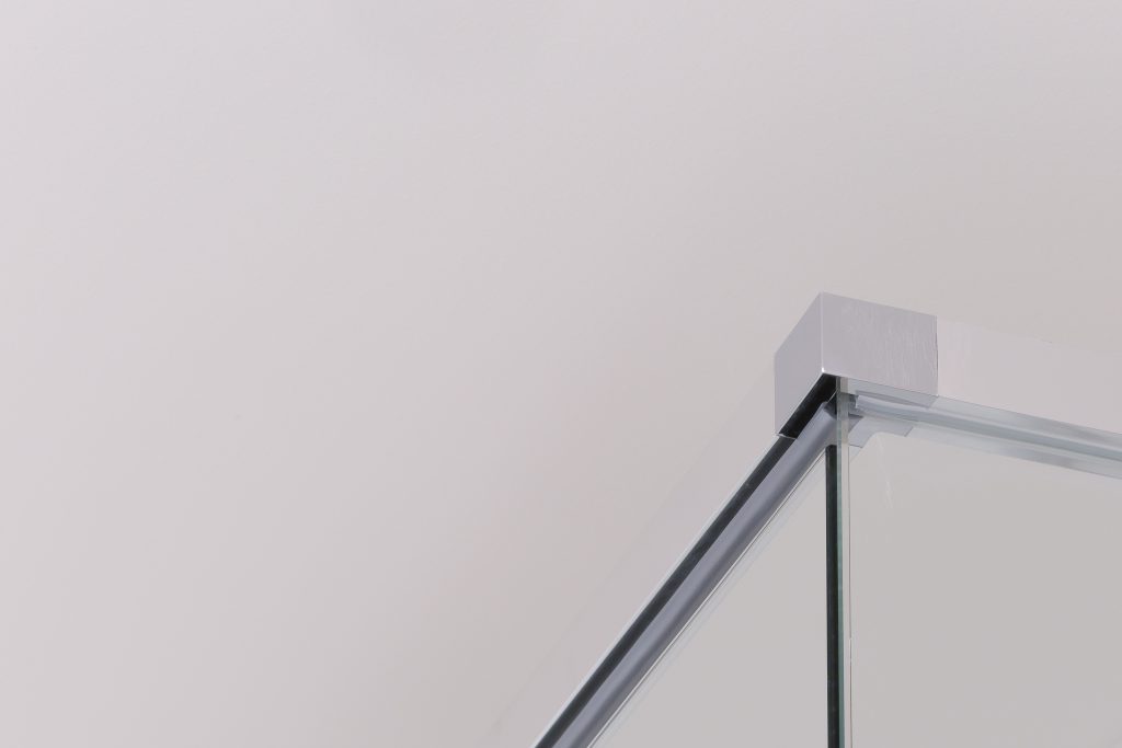 Polished silver aluminium framing and stainless edges for corner showerscreen