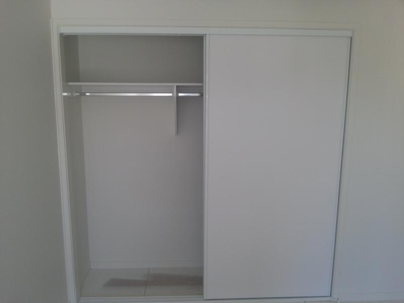 White Sliding Robe Door with Garment Compartment and Chrome Hanging rail and top shelf