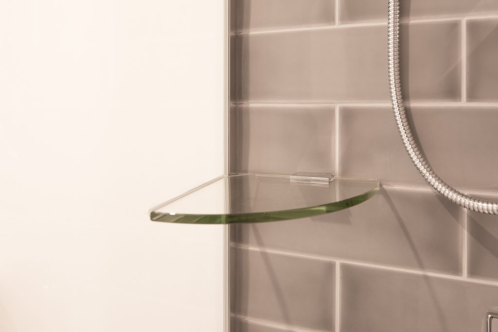 glass brace, measurements: 150mm, 200mm, 250mm or 300mm. Stainless gussets attached drilled to wall. glass glued to glass with silicone.