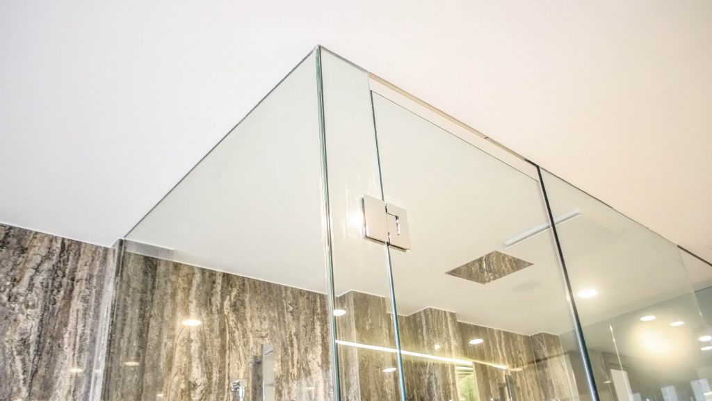 Luxury bathroom with Frameless Shower Screen and silver polished hinges