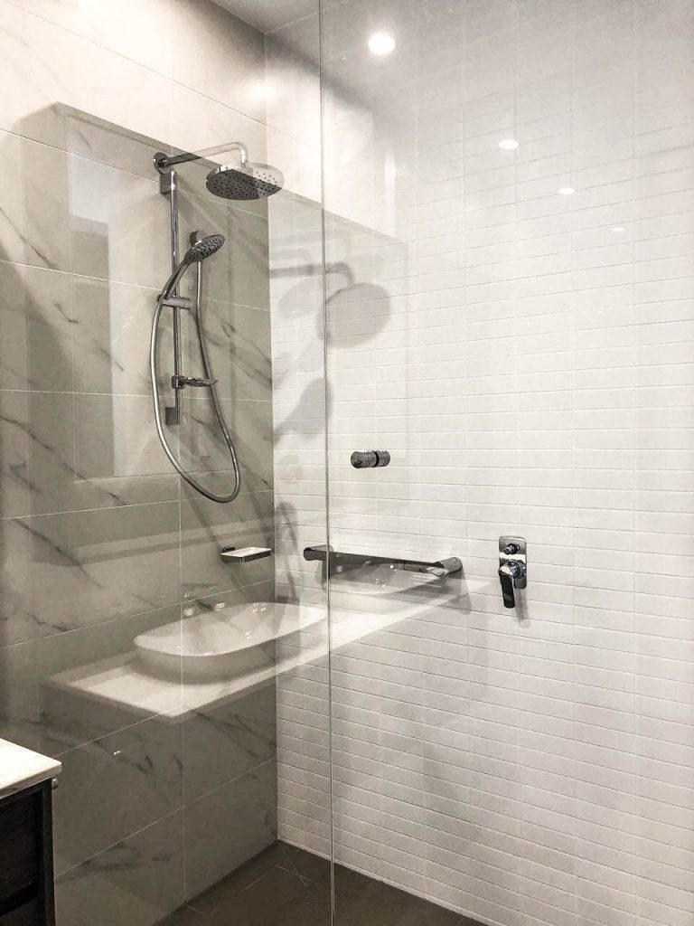 Frameless Panel on sleek modern bathroom