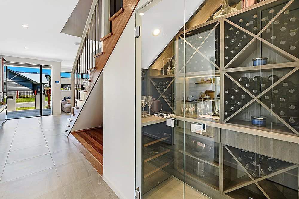 Wine Cellar - Frameless 10mm Glass Doors with Polished Silver Handles; Colour Board Shelving & a Mirror Splashback
