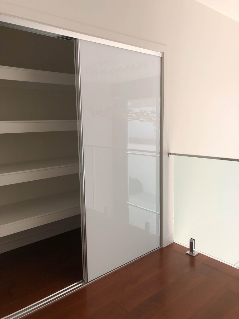 Frameless Super White Robe Doors with Polished Silver Handles & White Board Shelving