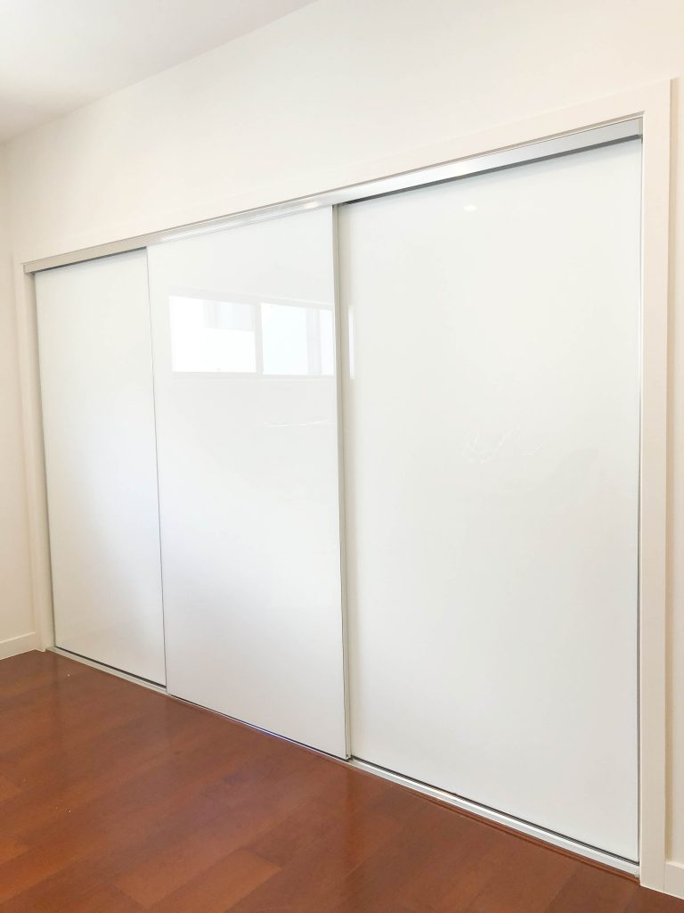 Frameless Wardrobe Doors in low iron white glass three panels