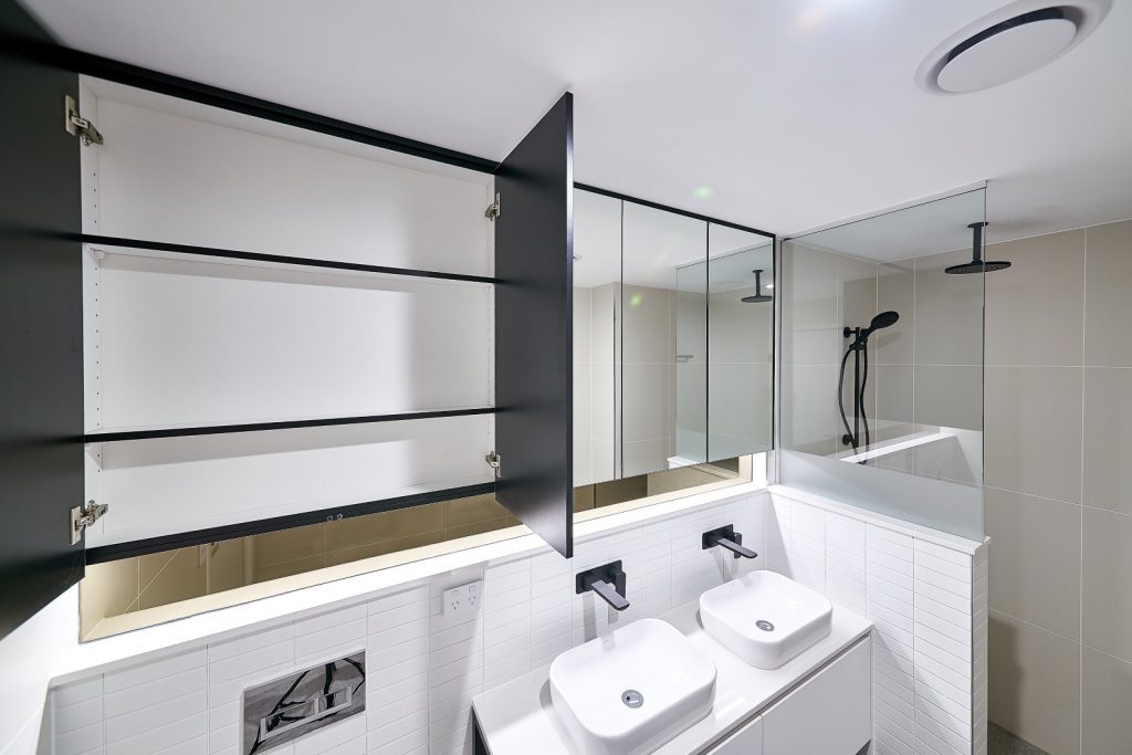 Matt Black & Mirror Shaving Cabinets with a Frameless Shower Screen Panel including a Privacy Strip