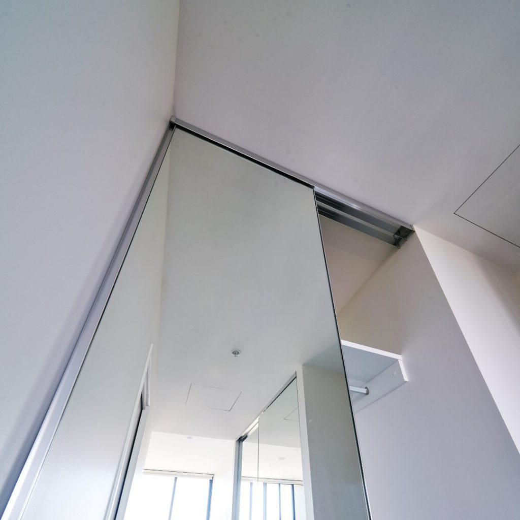 Frameless Mirrorline Robe Door in Silver Aluminium Track in Top view