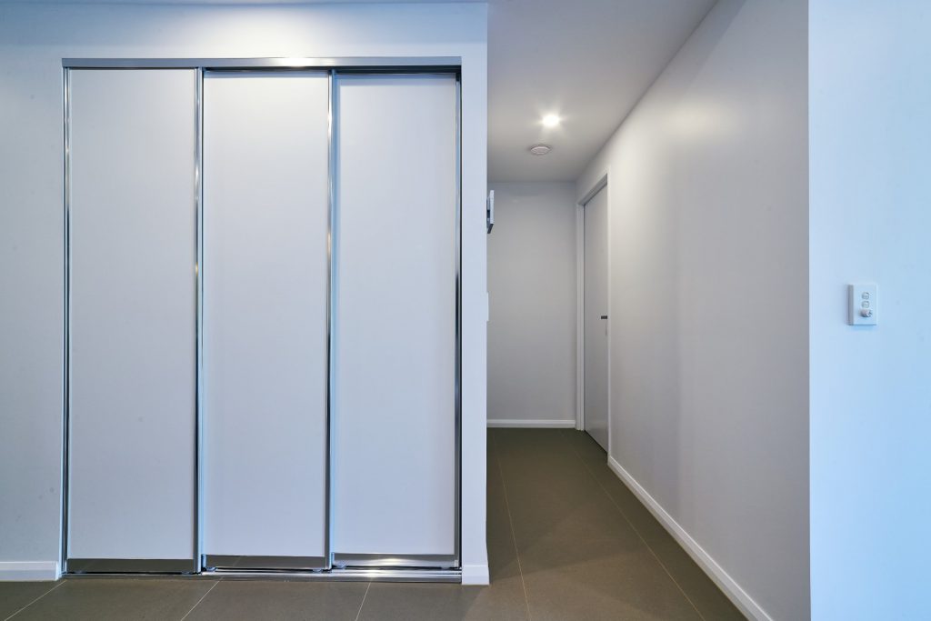 Slimline Polished Silver Robe Doors with Standard White Board Shelving with Silver Aluminium Frame