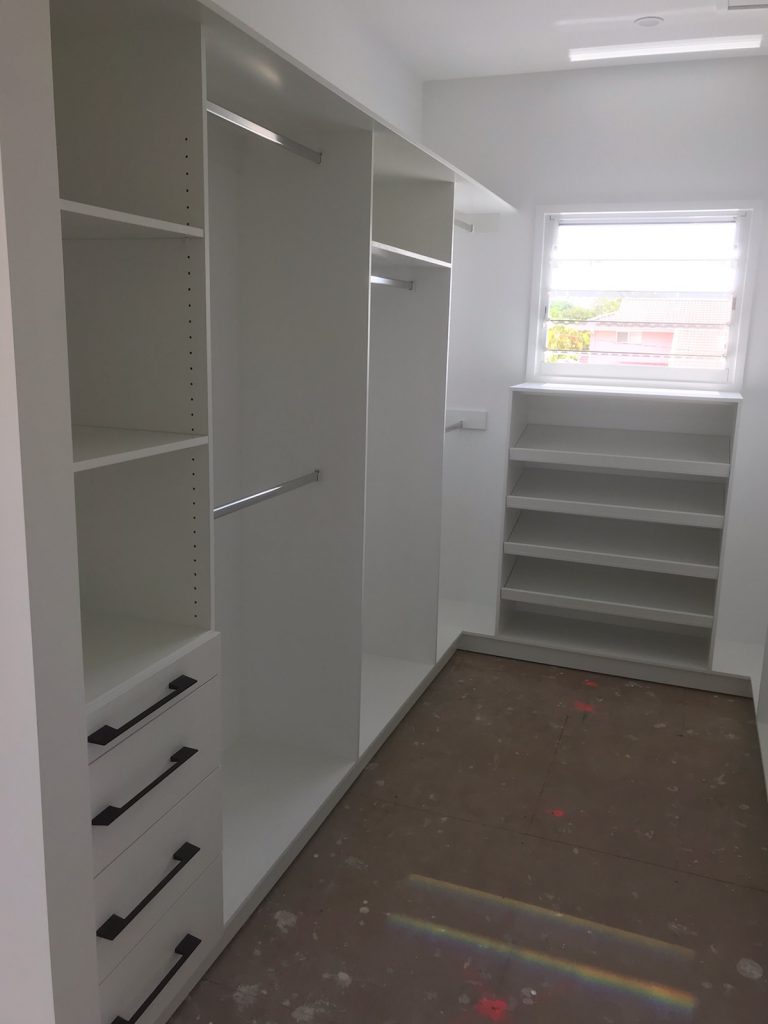 Built-In Wardrobe - White Board Shelving, Banks of Drawers, Chrome Hanging Rods & a Shoe Cupboard