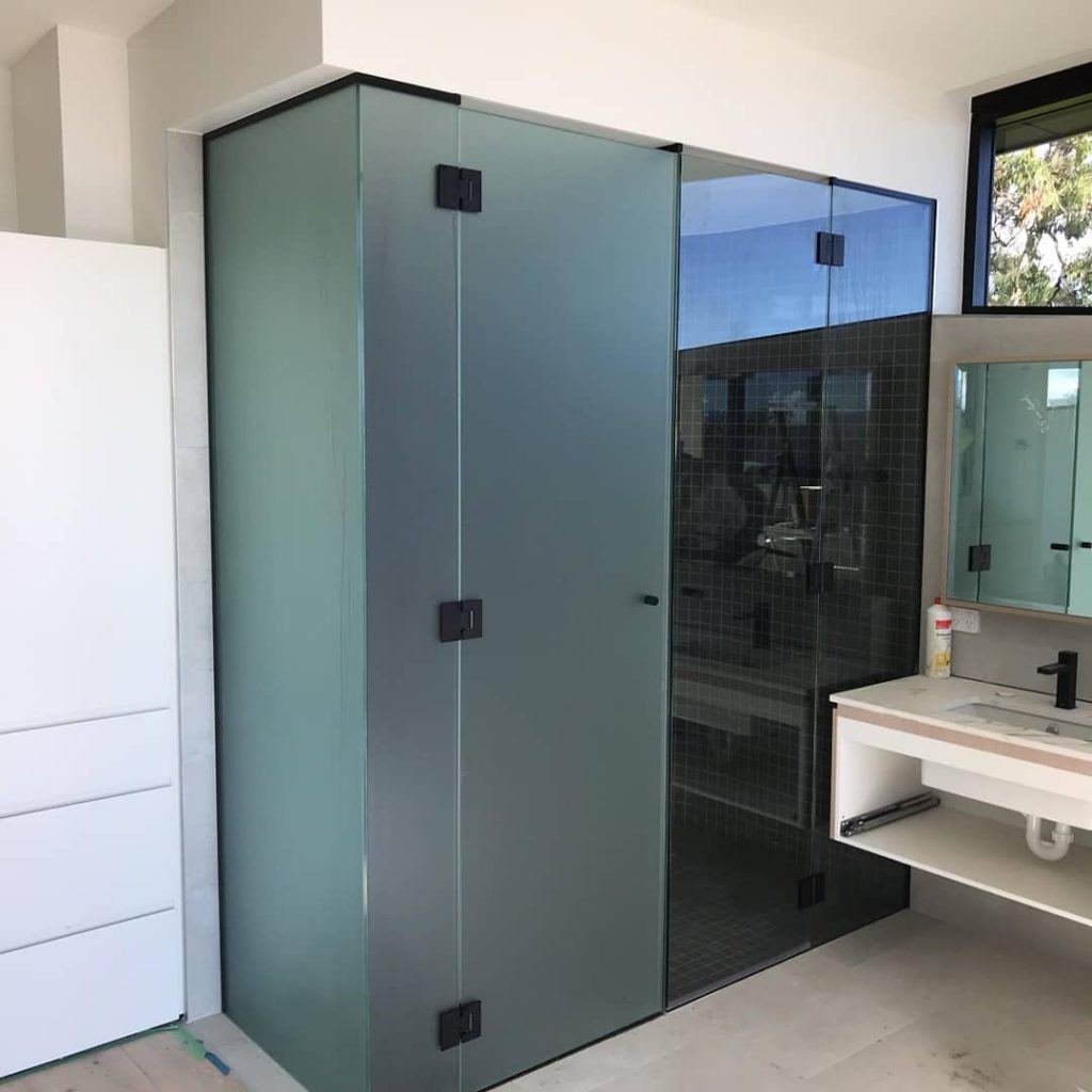 Frameless T-Screen for Shower & Toilet area. LHS glass is acid etched (toilet) and RHS is clear glass (shower) with Black Hinges2