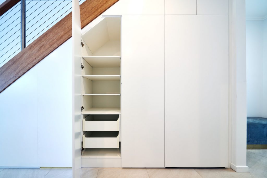White Hinged Doors (under staircase) with White Board Shelving & Drawers