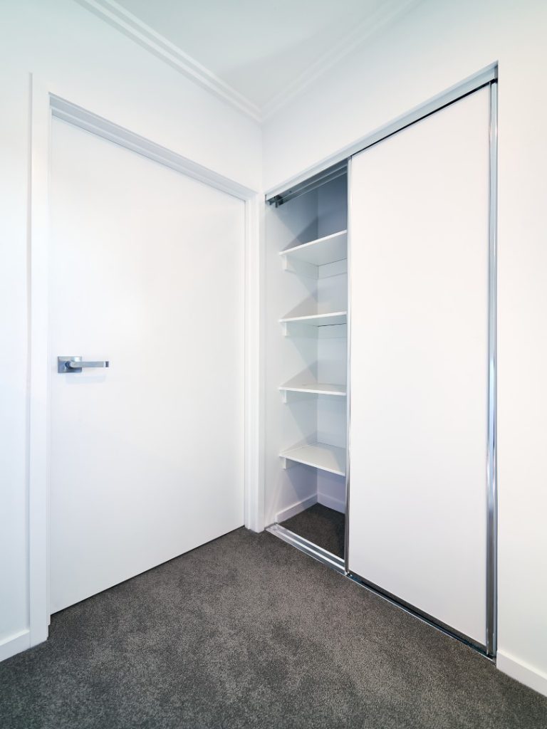 Polished Silver Framed Vinyl Robe Doors with Polished Silver Tracks & White Board Shelving