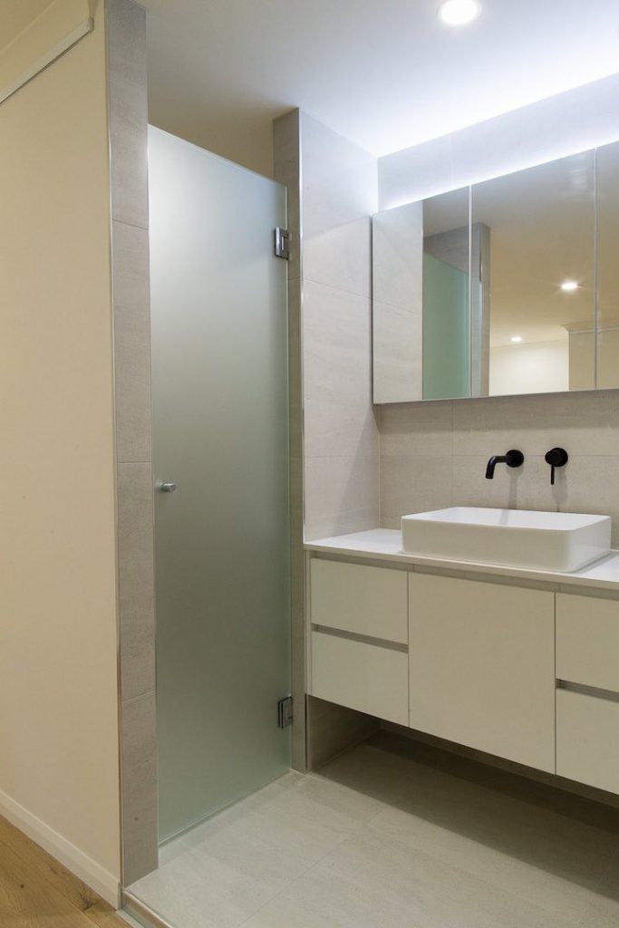Frameless Hinged Civic Glass Bathroom Screen with white Vanity