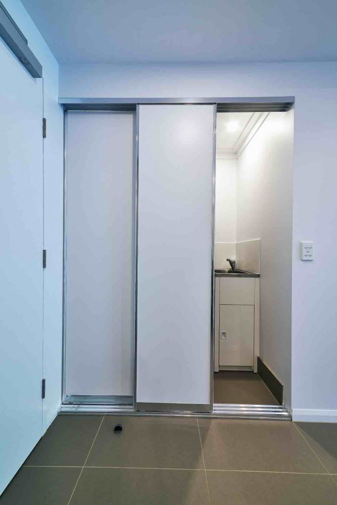 Slimline Robe Doors with Three Panels in front Laundry Compartment with Silver Aluminium Frame