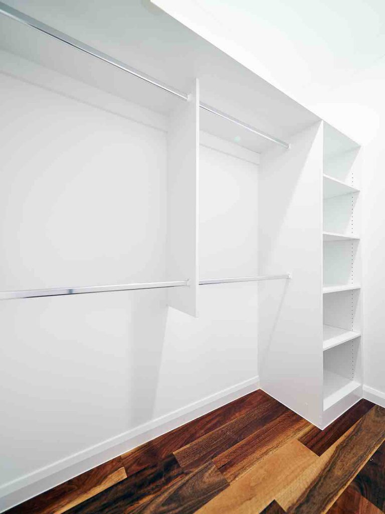 Polar White Wardrobe with four polish silver hanging rails and multiple shelves