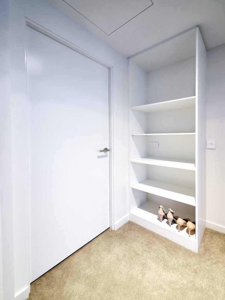 Classic White Wardrobe white storage compartment with white swing doorr