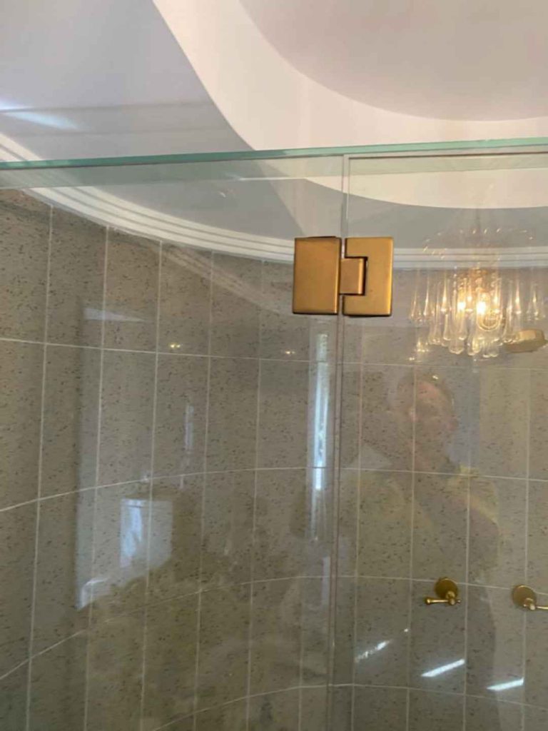 Frameless shower screen with nice gold polished hinges