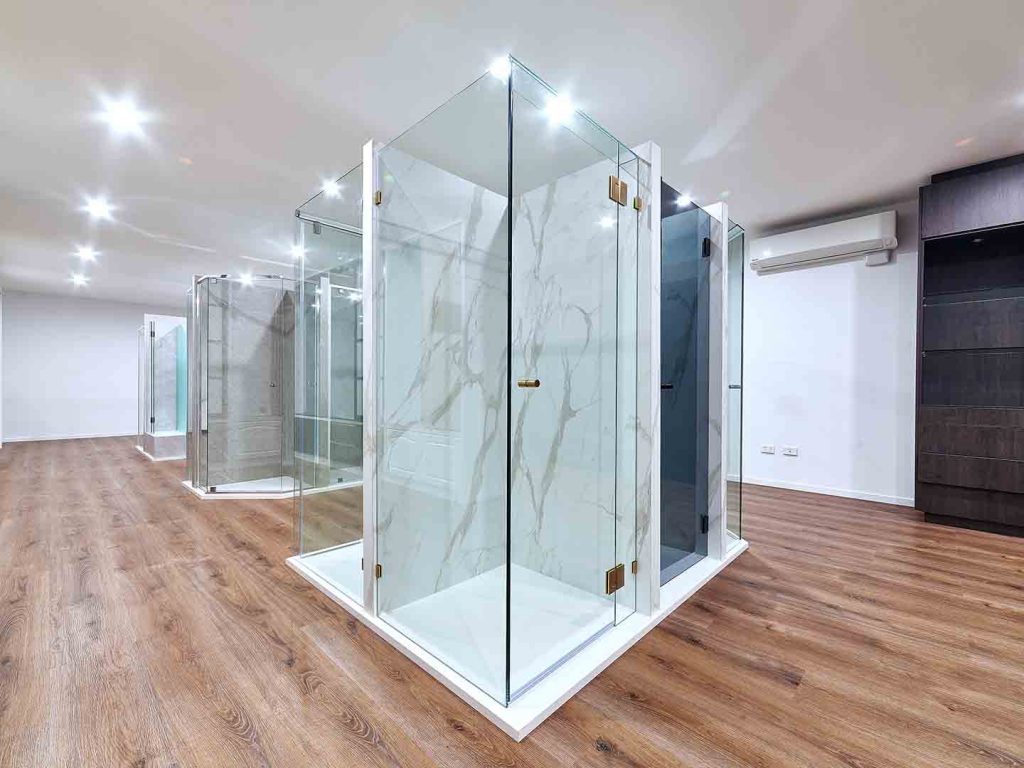 frameless hinged shower screen in showroom